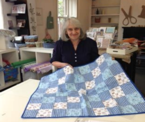Gill with her quilt